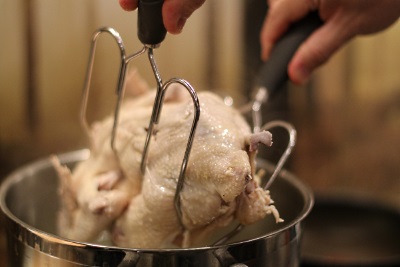 Remove chicken using a pair of meat lifters