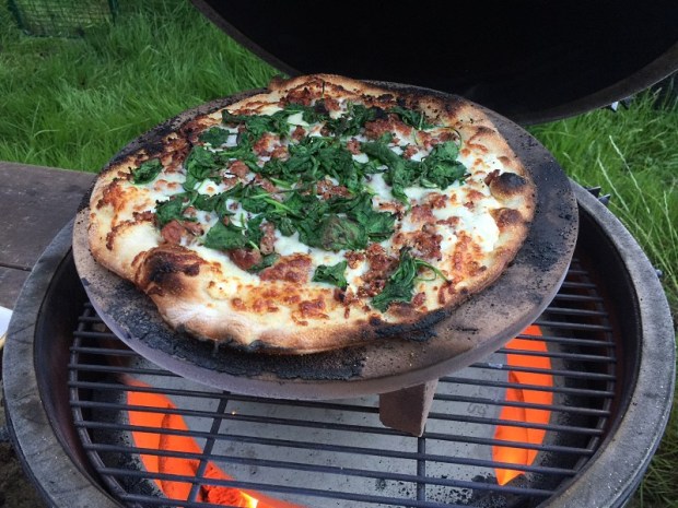 Pizza cooking on a Big Green Egg