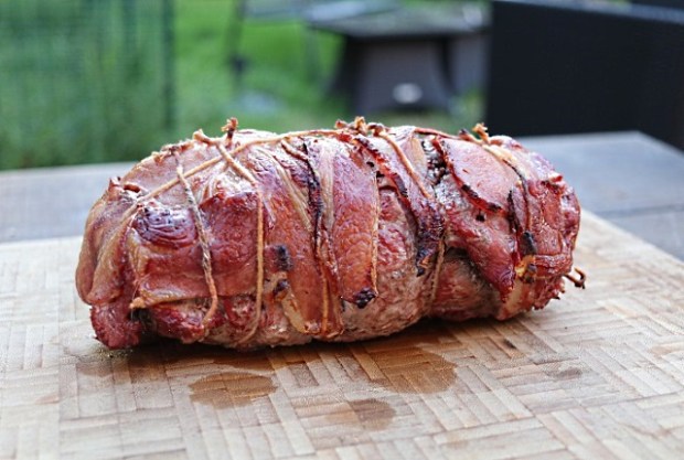 Bacon-wrapped pork shoulder cooked and ready to carve