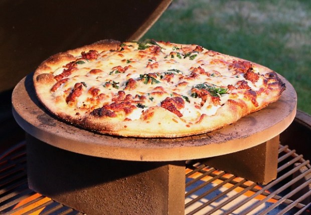 Pizza cooking raised into the dome