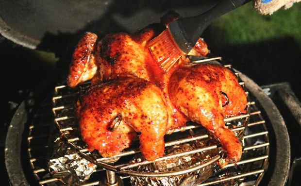 Applying the marinade to the chicken