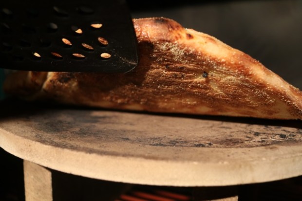 Checking that the base is cooked ... yep