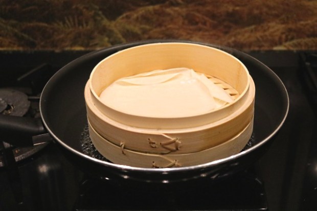 Steaming pancakes in a wok