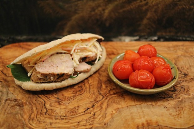 Pita bread stuffed with chicken, coleslaw and lettuce