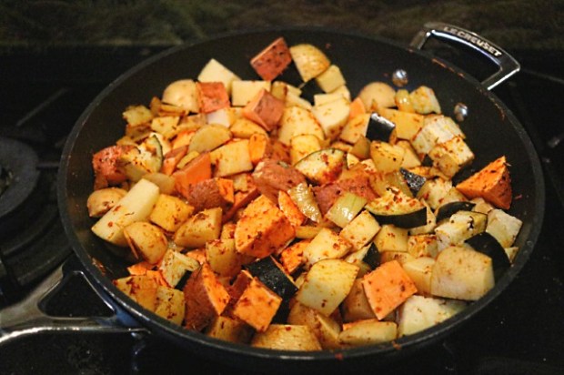 Stirring the vegetables together with the onions and aromatics