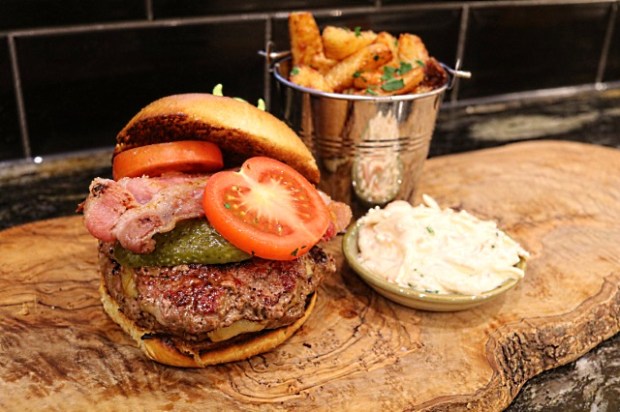 Umami smash burger served with chips and coleslaw