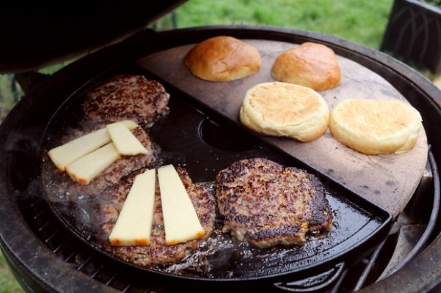 Melting the cheese into the burger