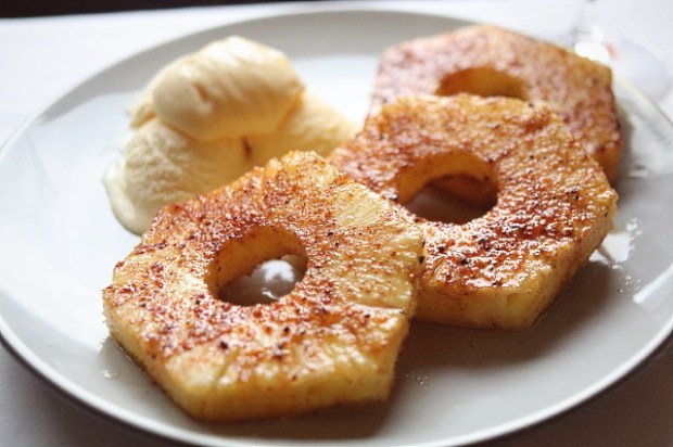 Sweet 'n' spicy baked pineapple served with vanilla ice cream