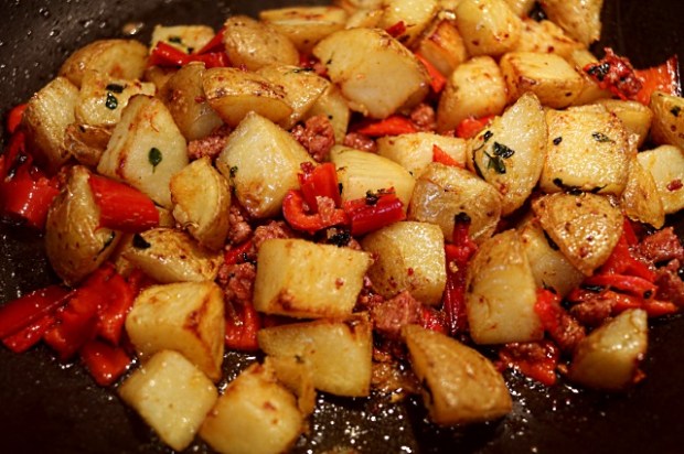 Potatoes, red pepper and chorizo cooking