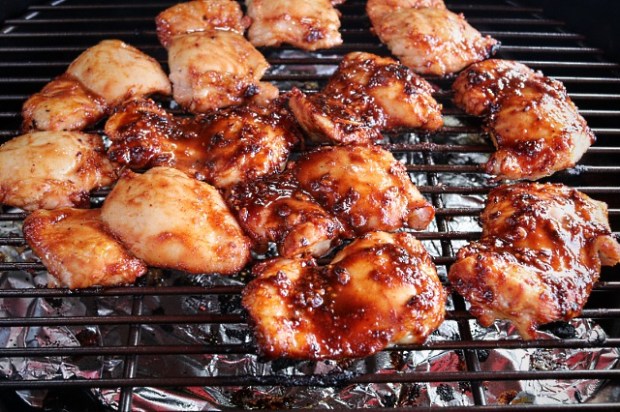 Chicken thighs cooking in a Big Green Egg