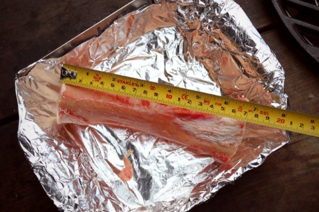 The cut bone in a small vegetable basket lined with kitchen foil