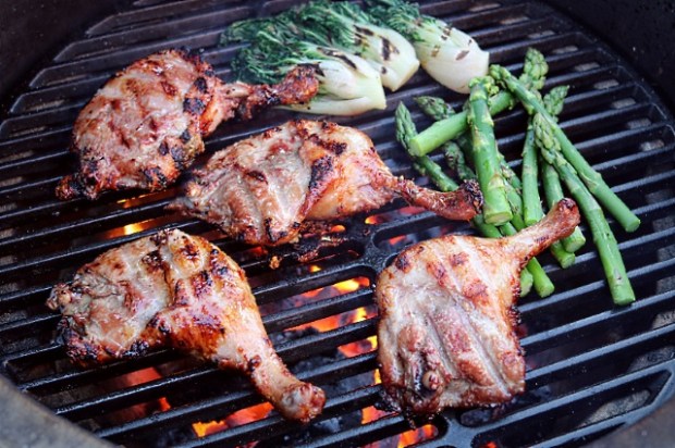 Searing duck legs and vegetables in a Big Green Egg