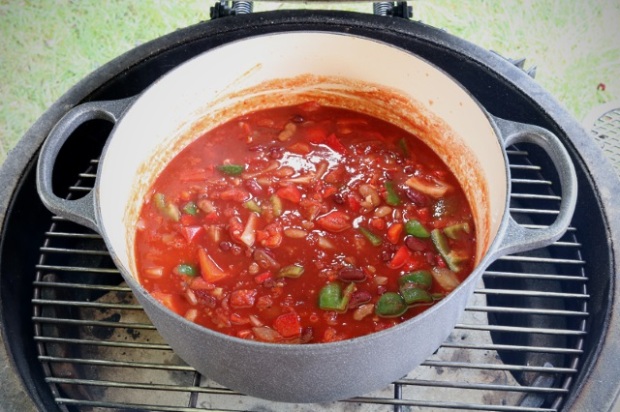 Chili ready to have ball of meat placed on top and cooked