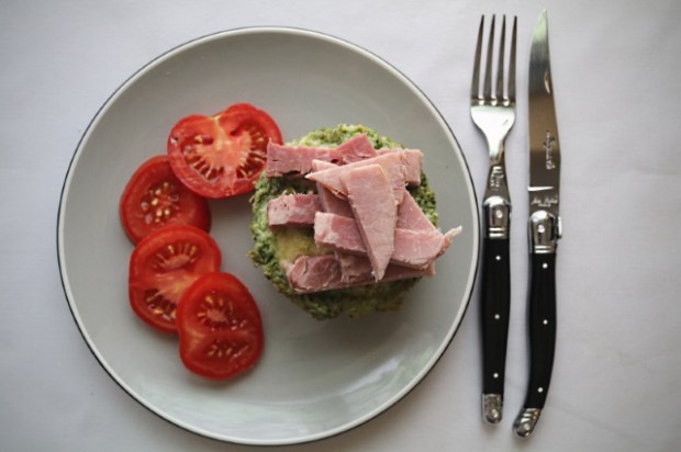 Green eggs and ham served on a toasted crumpet