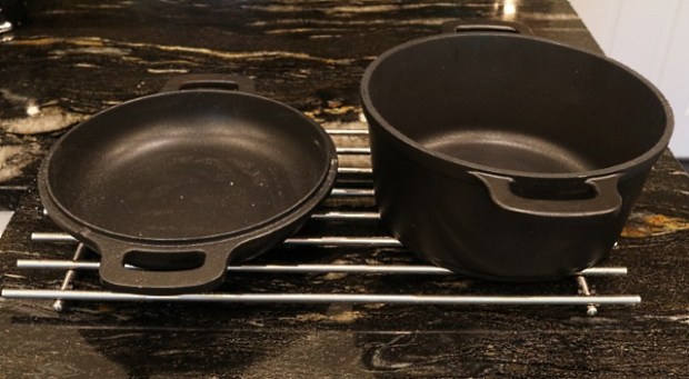 Dutch oven on a trivet with the lid ready for dough