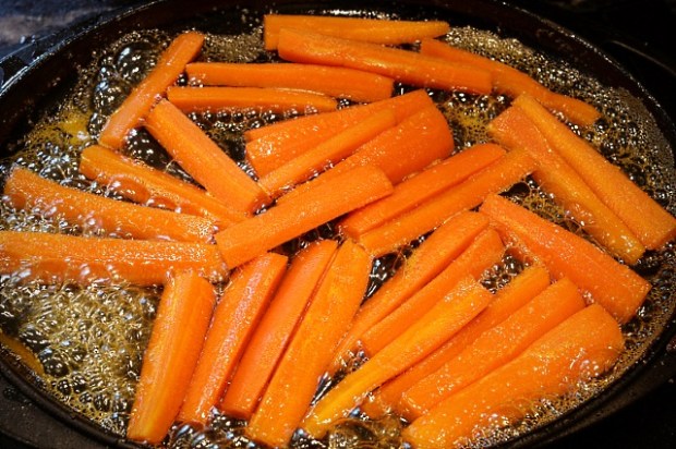 Sauteing the carrots in the sauce after removing from sous vide
