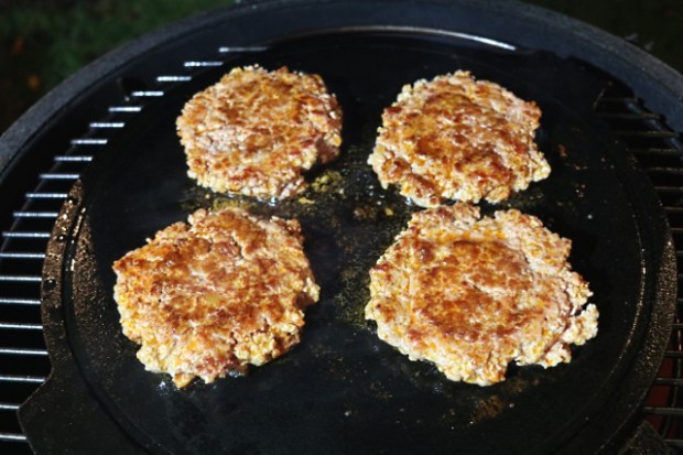 Pork and chorizo burgers cooking in a Big Green Egg