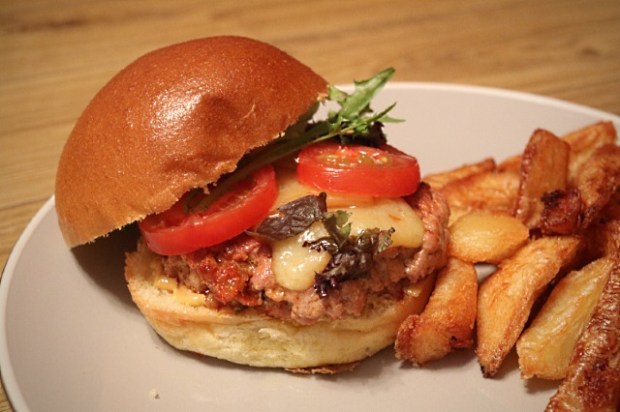 Pork and chorizo burger served with triple cooked chips