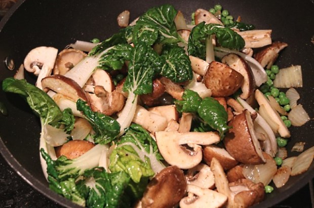 Vegetables stir frying in a wok