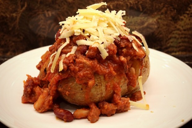 Smokey chipotle beans with a baked potato and grated cheese