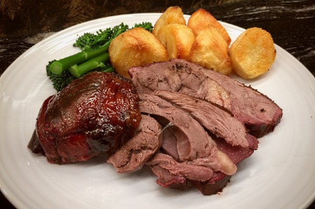 Roast leg of mutton with roast potatoes and broccoli