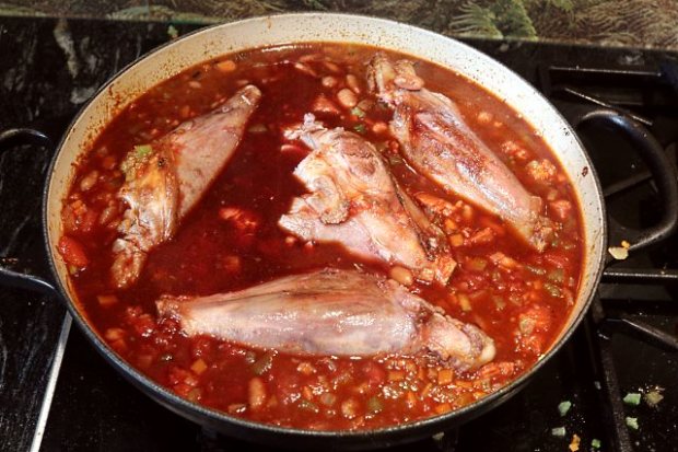 Stirring into the red wine sauce