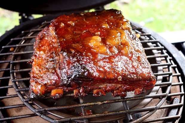 Final glaze application after unwrapping from kitchen foil