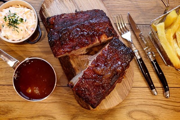 Apricot preserve glazed pork served with sauce and sides