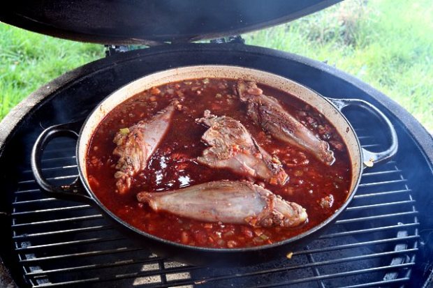Lamb shoulder shanks smoking over apple wood