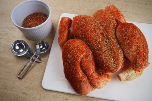 Chicken with rub applied, ready to cook