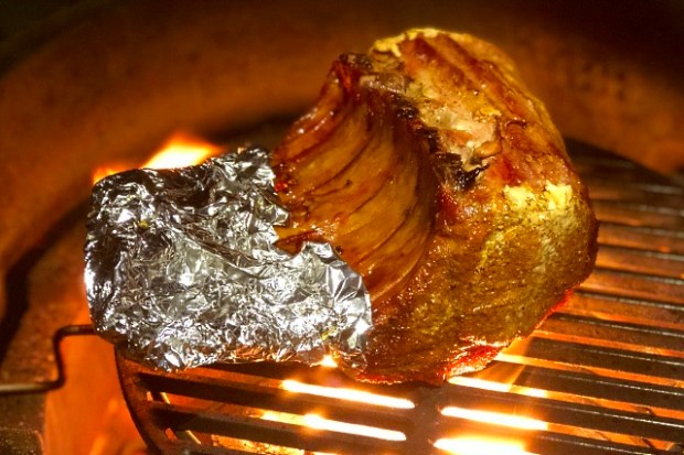 Searing the ribs, protecting the bones with foil