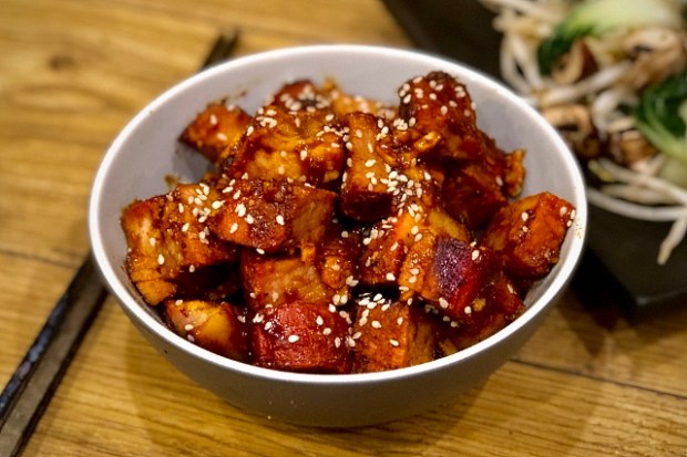 Asian pork leg steaks served with pak choi and mushrooms