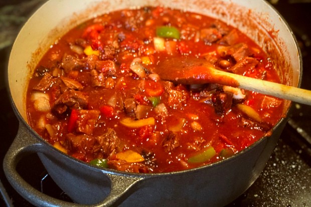 Adding the beans, tomatoes and liquid ingredients