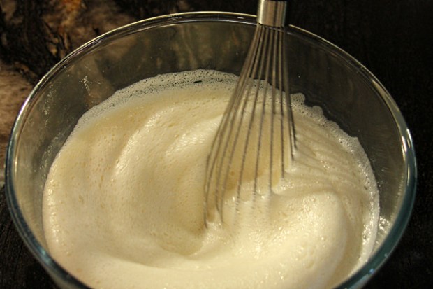 Whisking the batter mix vigourously to aerate it